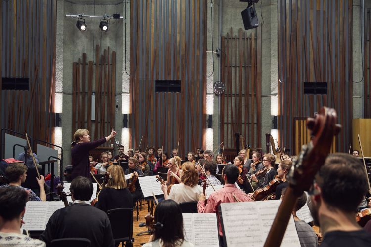 Marin Alsop conducts an orchestal rehearsal in Silk Street Music Hall